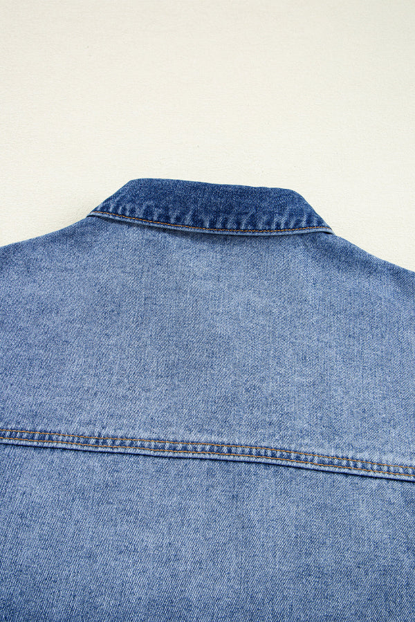 Blue denim jacket on a light beige background