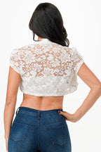 Crochet lace cropped shrug with open front and cap sleeves.