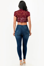 Crochet lace cropped shrug with open front and cap sleeves.