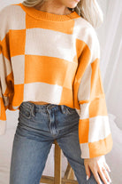 Women's SweatersOrange Checkered Bishop Sleeve Sweater - VacationGrabs