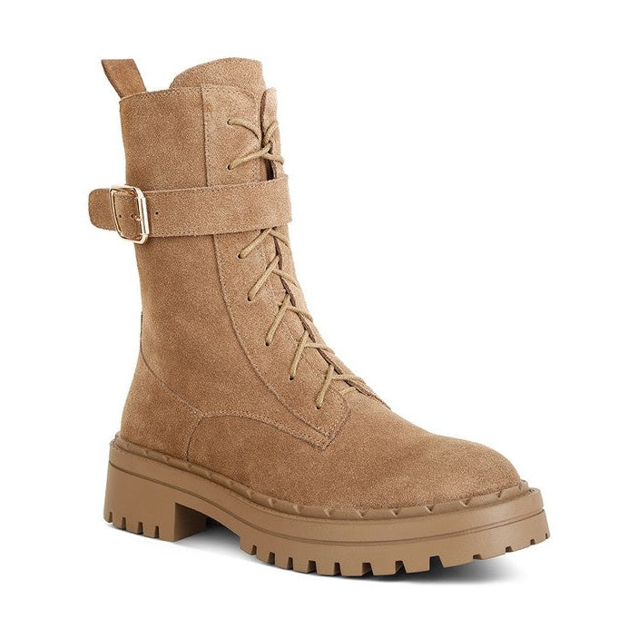 Tan suede lace up boots for women featuring a sturdy sole and stylish buckle detail