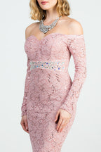 Off the shoulder long sleeve sweetheart sequin lace gown with waist embellishment.