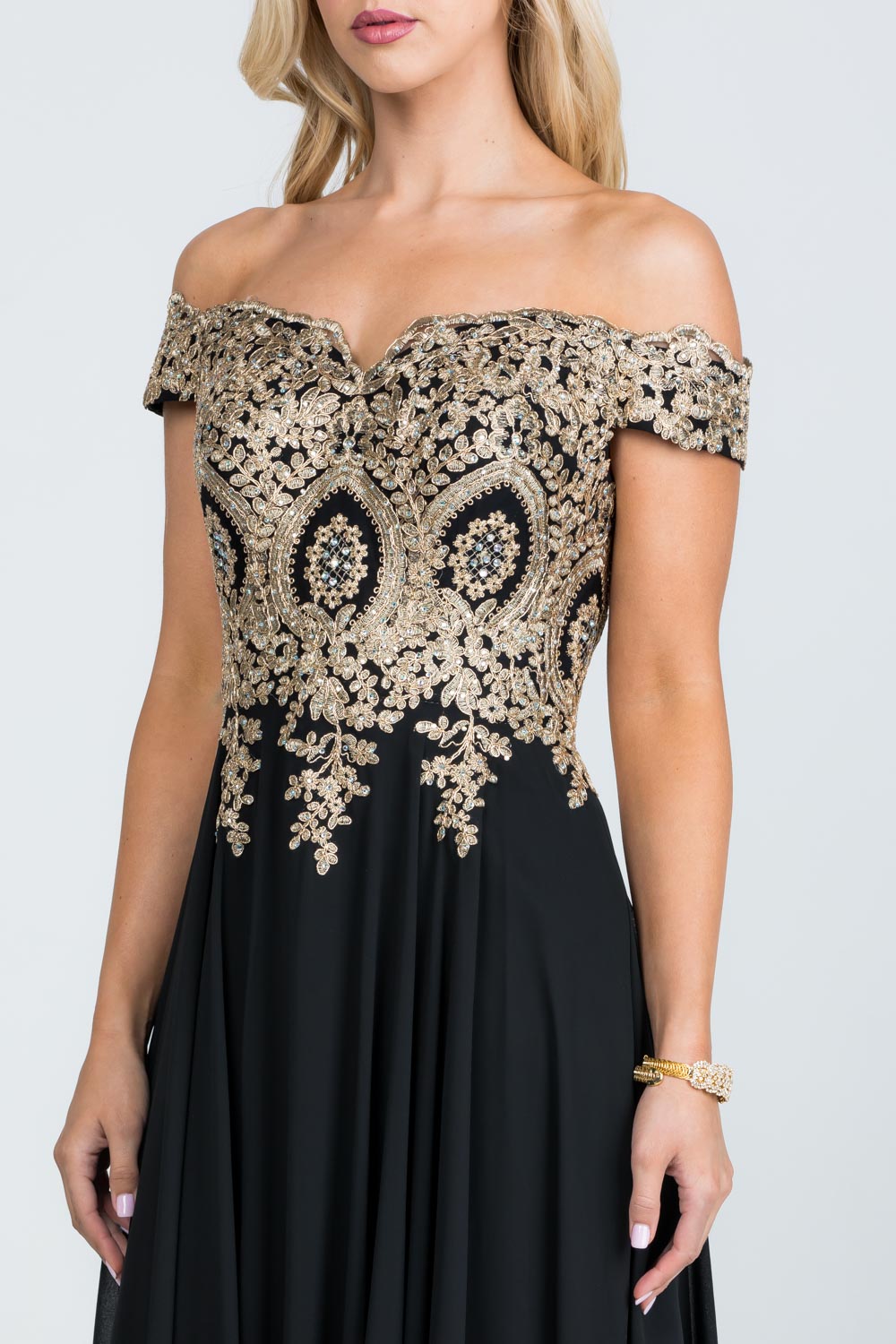 Off the shoulder chiffon gown embellished with gold lace appliques