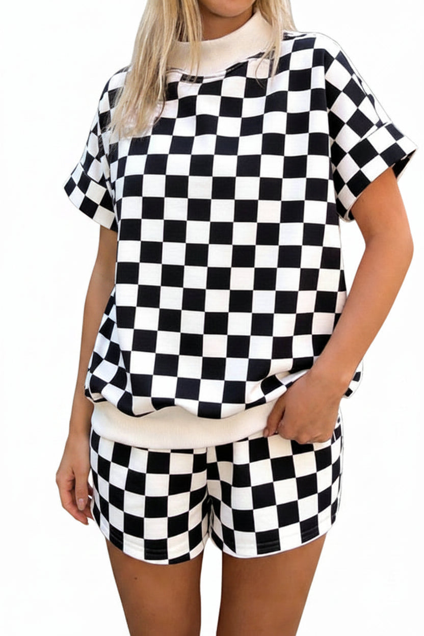 Person wearing a black and white checkered outfit on a street.