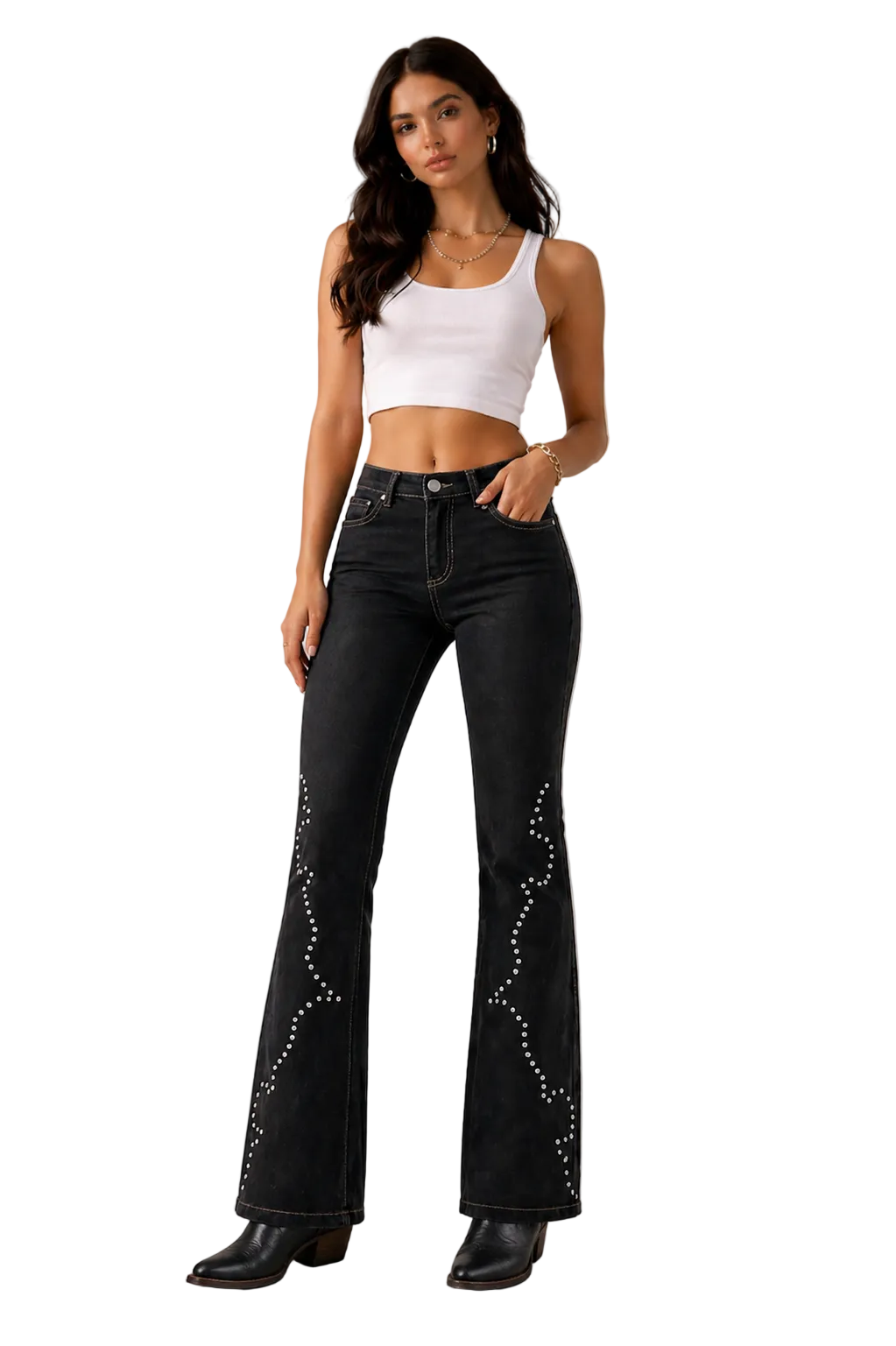 Woman wearing black flared jeans with white embellishments on a beige background