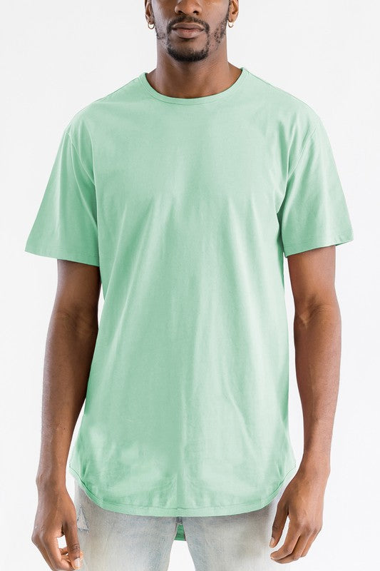Man wearing a light green t-shirt on a white background