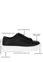 Women's black embellished chunky sneakers with elevated platforms and stud details