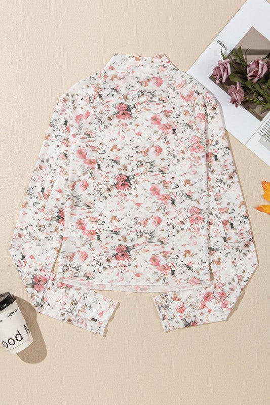 Back view of a JUNIPER BLVD mock neck floral blouse for women with a delicate pink floral pattern