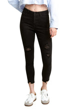 Women's black skinny pants jeans with distressed details for casual wear