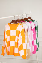 Women's SweatersOrange Checkered Bishop Sleeve Sweater - VacationGrabs