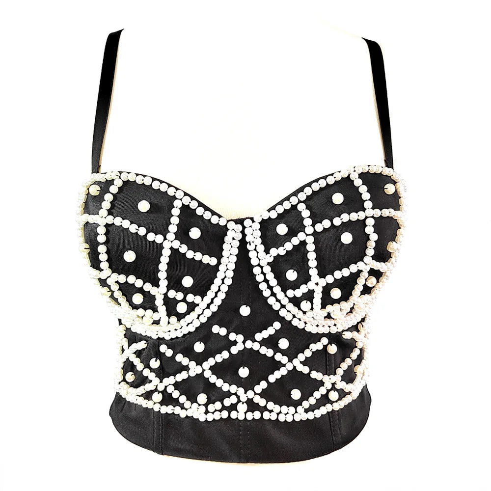 Black leather top with white bead embellishments on a white background