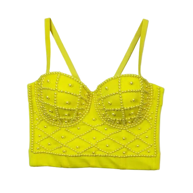 Yellow bralette with pearl embellishments on a white background