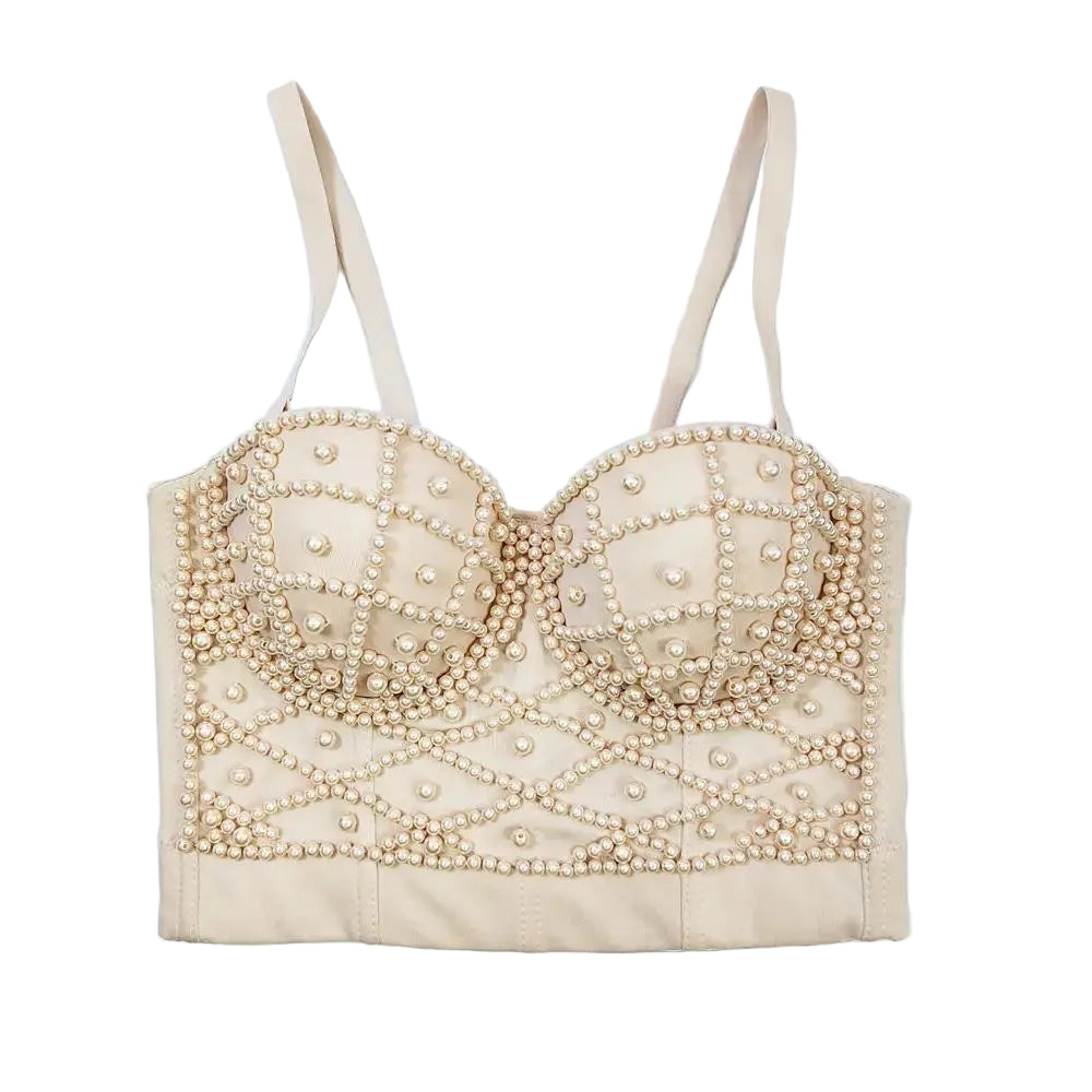 Beige bralette with pearl embellishments on a light blue background