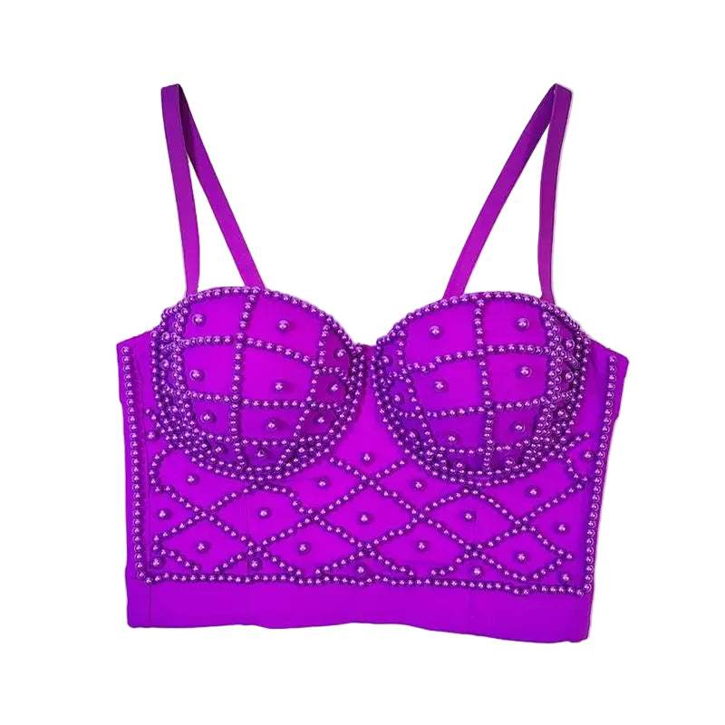 Purple bra with decorative studs on a white background
