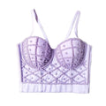 Lavender bralette with bead detailing on a gray background