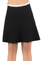 Black skirt with white trim on a plain background