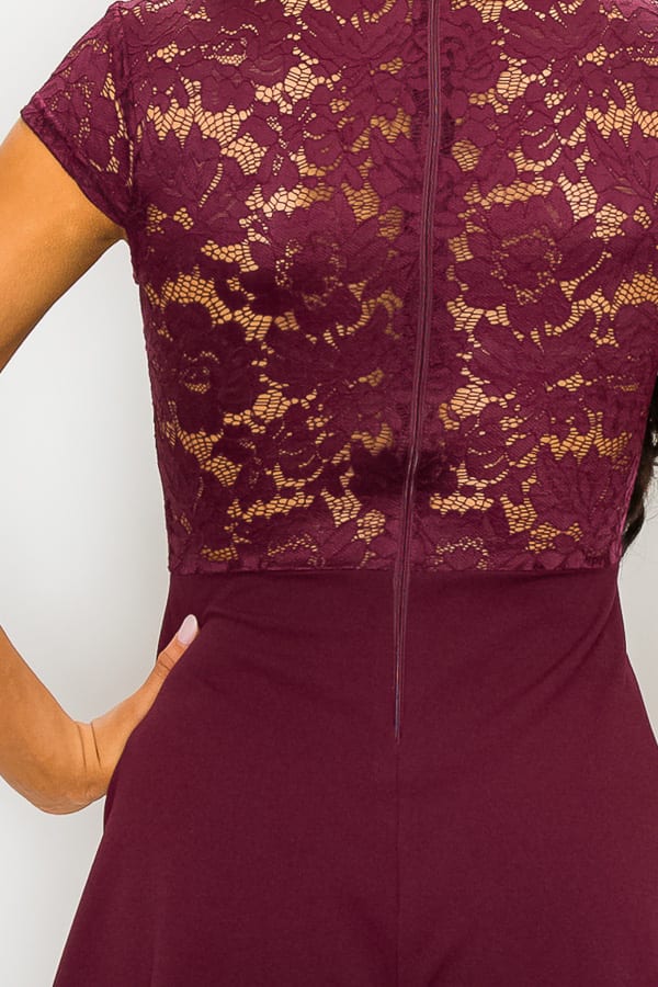 Close-up of the back detail of a sheer lace combo romper in burgundy from VacationGrabs