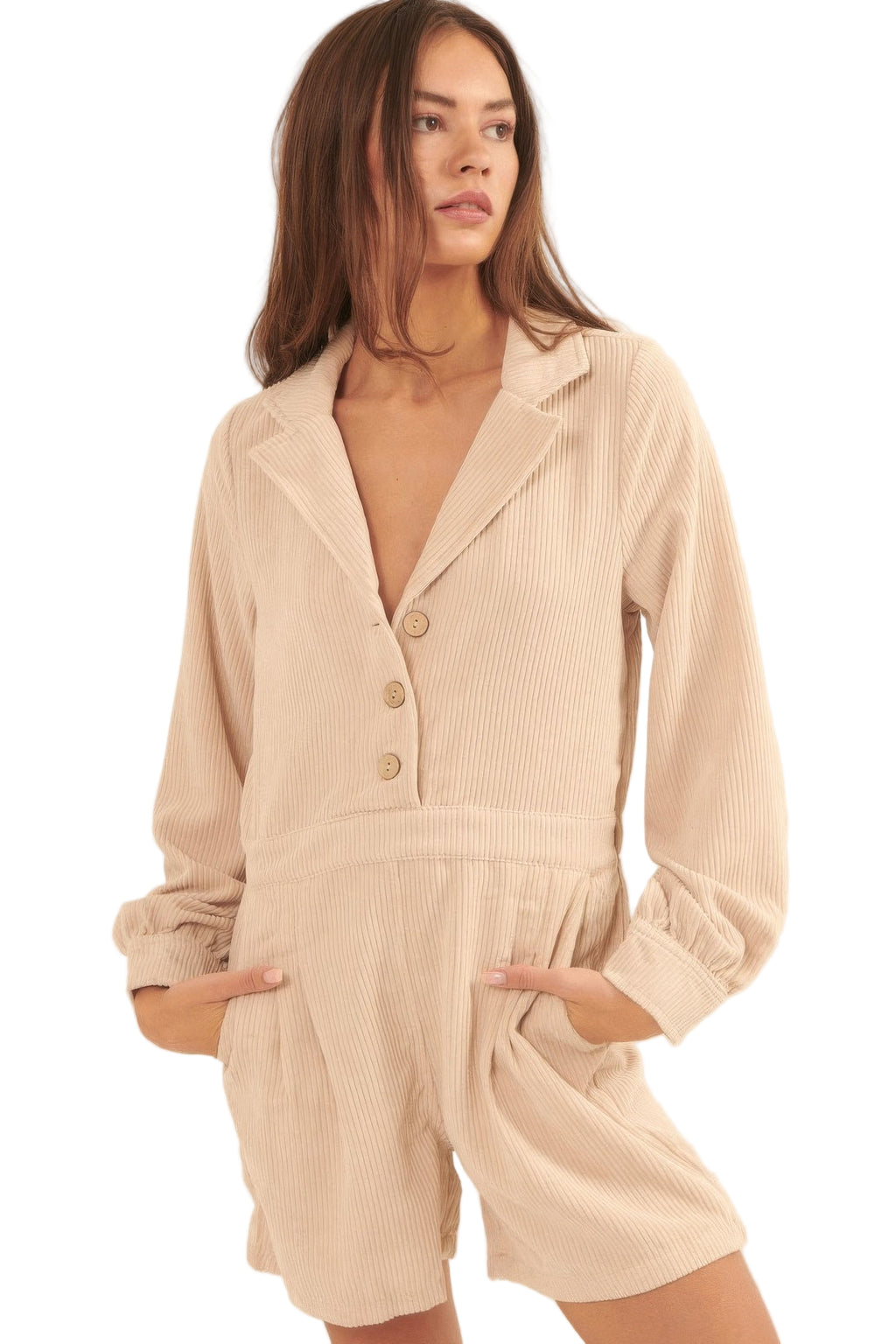 Beige corduroy romper for vacation featuring a collared neckline and button front with pockets