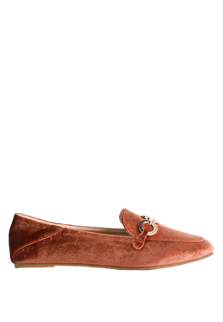 Brown velvet loafer with a decorative buckle on a white background