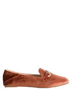 Brown velvet loafer with a decorative buckle on a white background