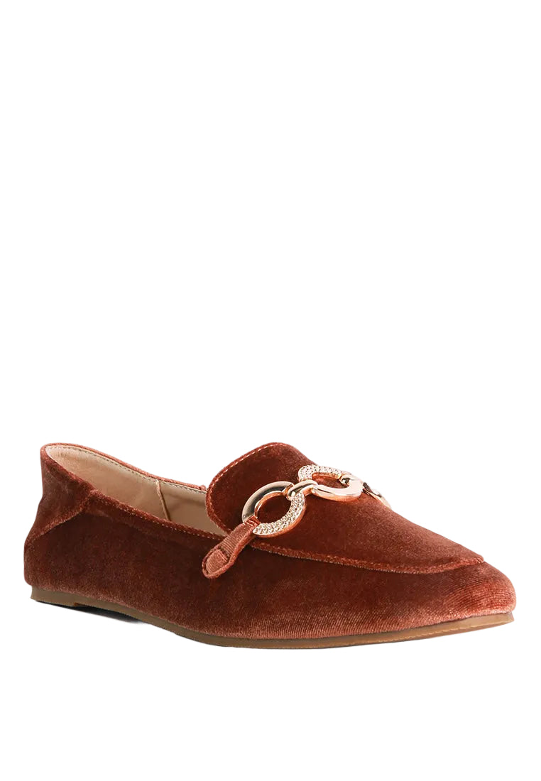 Brown velvet loafer with a decorative chain on a white background