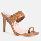 Tan high-heeled sandal with woven design on a white background