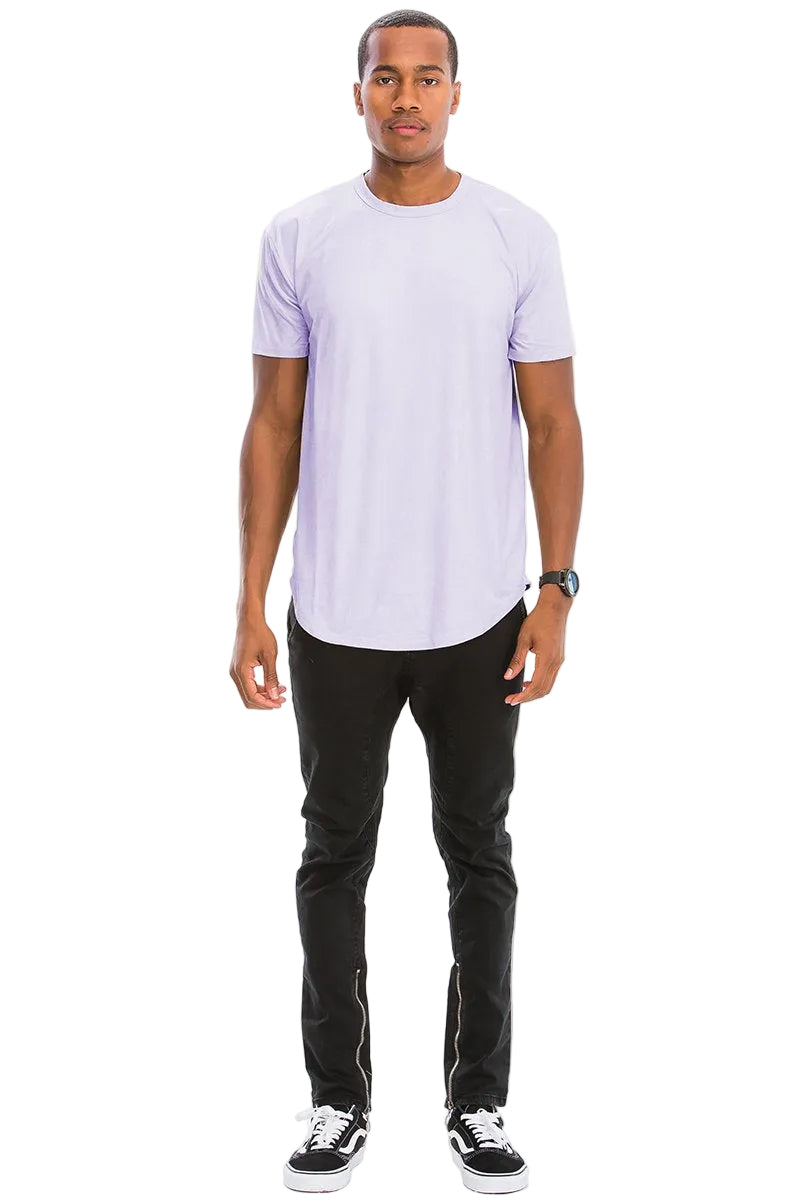 Man wearing a light purple t-shirt and black pants on a white background