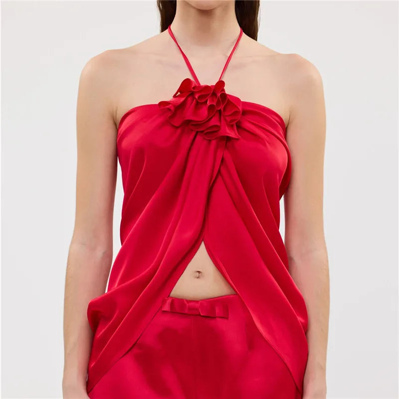 Red satin halter-top with floral detail, perfect for evening wear