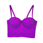 Purple bralette with decorative patterns on a white background