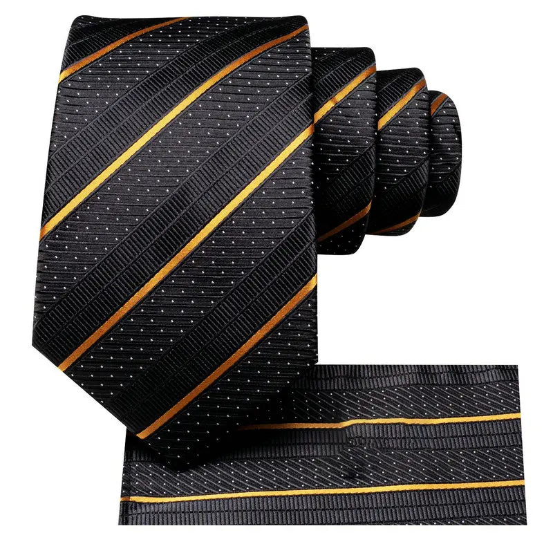 Men's black striped tie, silk material, for formal occasions. Learn how fold a pocket square.