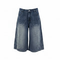 A pair of blue denim culottes displayed on a dress form mannequin against a plain white background.