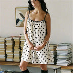 Women's polka dot mini dress in white and black, perfect for casual wear