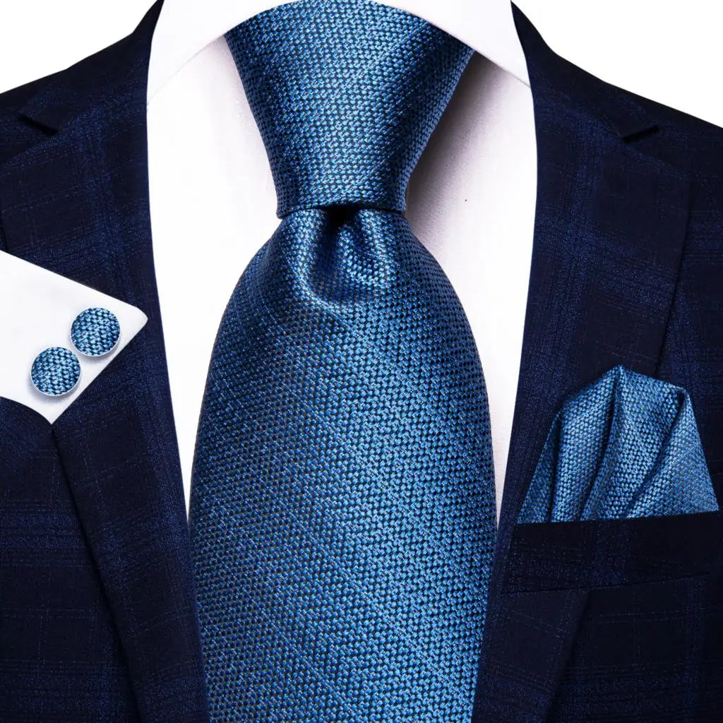 Men's navy tie and pocket square, perfect for learning how fold a pocket square