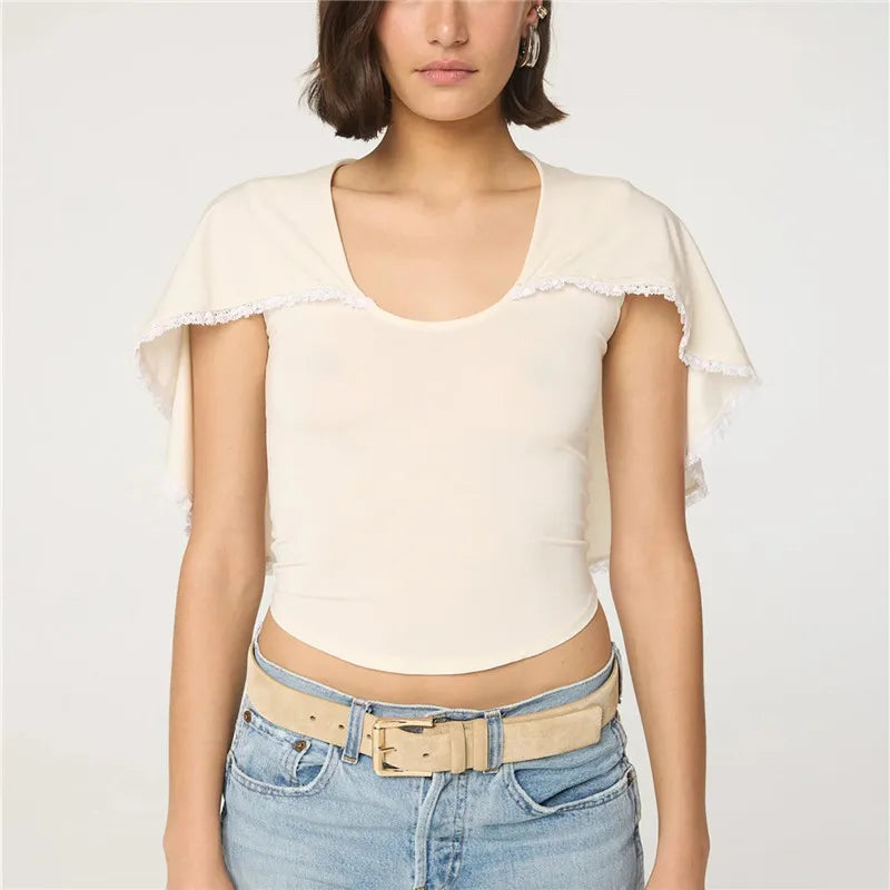 Women's cream top with lace and trim, perfect for casual outings