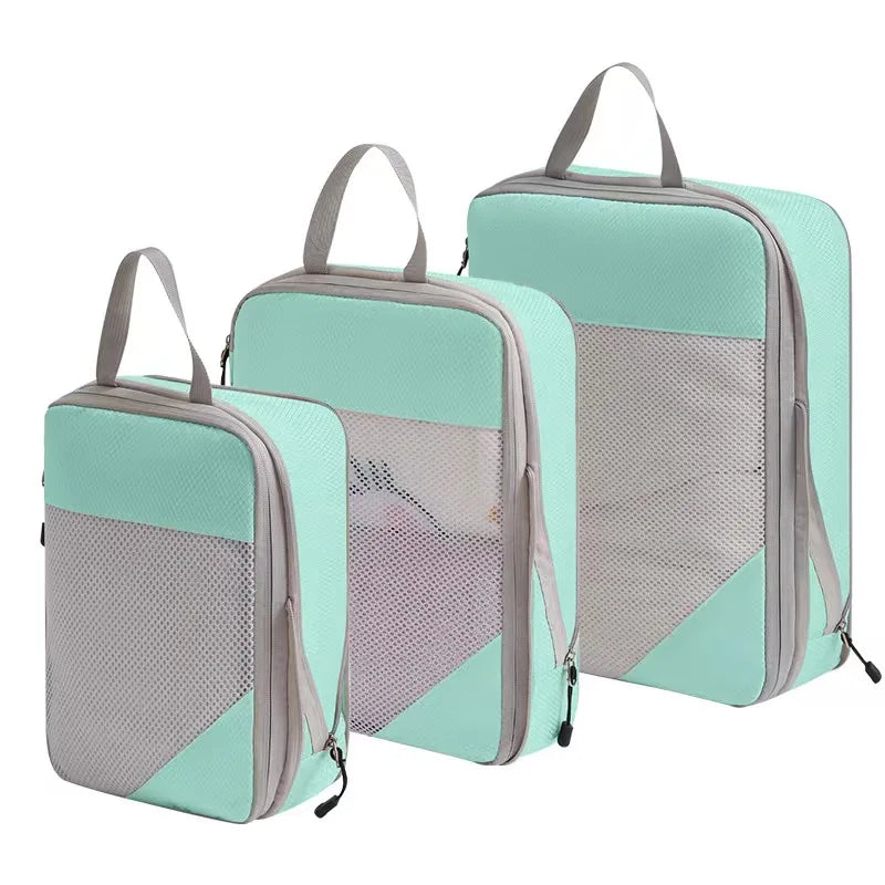 Set of mint green compression packing cubes for travel, lightweight and durable