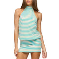 A woman wearing a sleeveless halter-neck mini dress with horizontal mint green and white stripes, shown against a plain light gray studio background.