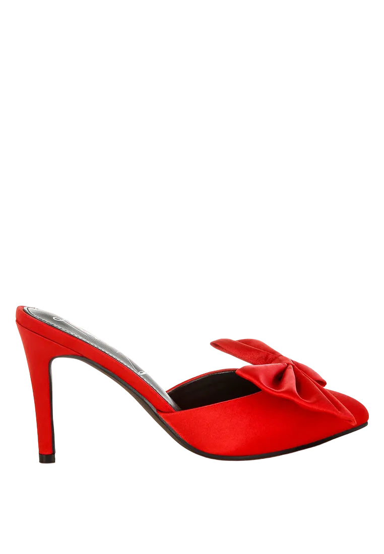 Red high-heeled shoe with a bow on a white background