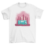 White t-shirt with a graphic of a teal camper van and trees on a white background