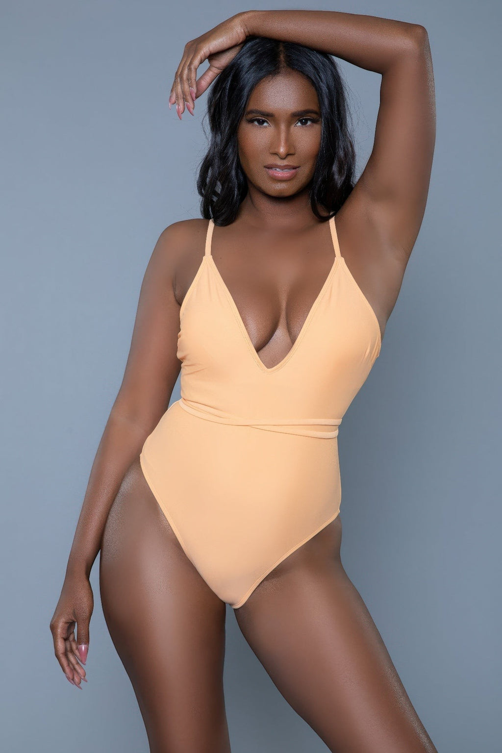 Women's peach swimmers swimwear, sleek one-piece for beach days