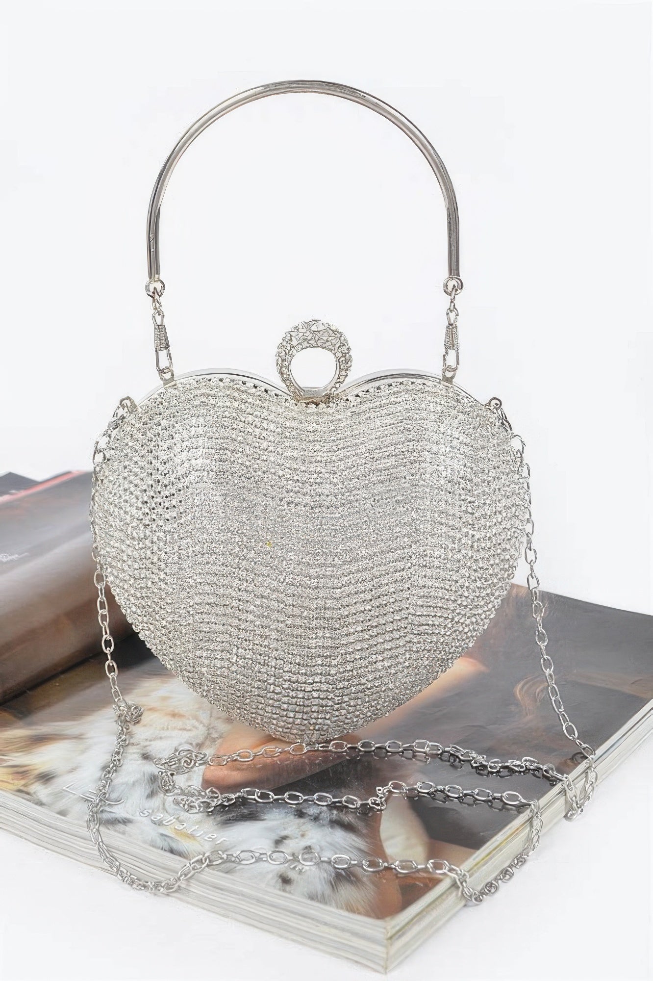 Rhinestone heart shape clutch with a silver chain strap for elegant outings and special occasions