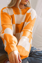 Women's SweatersOrange Checkered Bishop Sleeve Sweater - VacationGrabs