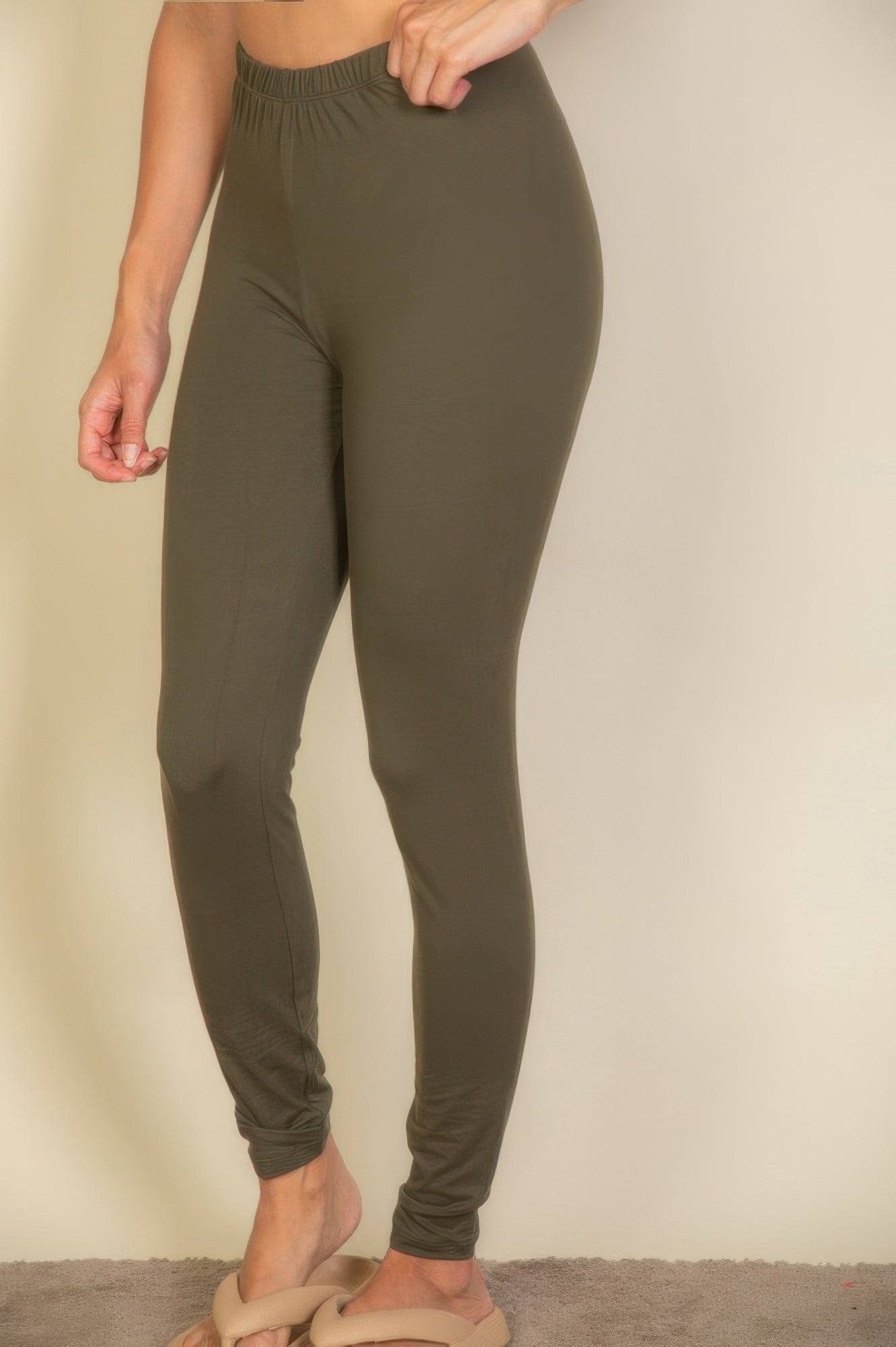 Olive green affordable leggings for vacation with a comfortable elastic waistband for easy movement