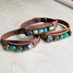 Handmade African turquoise cuff bracelet on leather, featuring unique turquoise stones in various shades