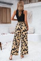 VacationGrabs women's allover print vacation pants with black geometric shapes on beige background