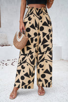 VacationGrabs women's allover print vacation pants with black geometric shapes on beige fabric