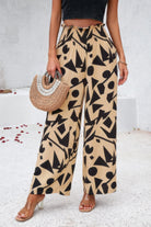 VacationGrabs women's allover print vacation pants with geometric black shapes on beige background