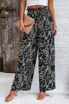VacationGrabs women's allover print vacation pants in black and white with wide legs and elastic waistband