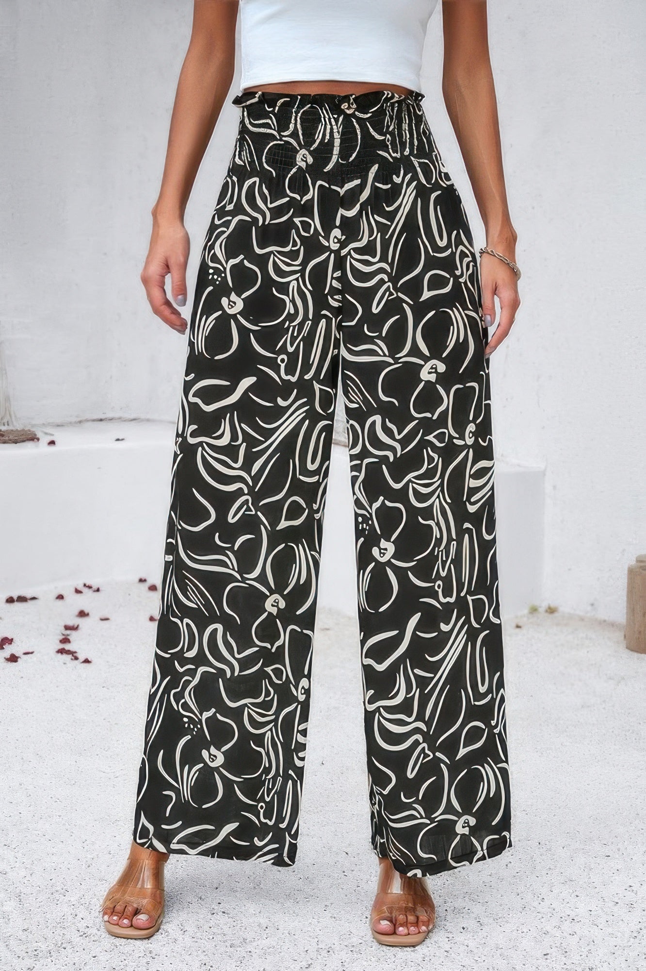 VacationGrabs women's allover print vacation pants in black with white floral design and wide legs