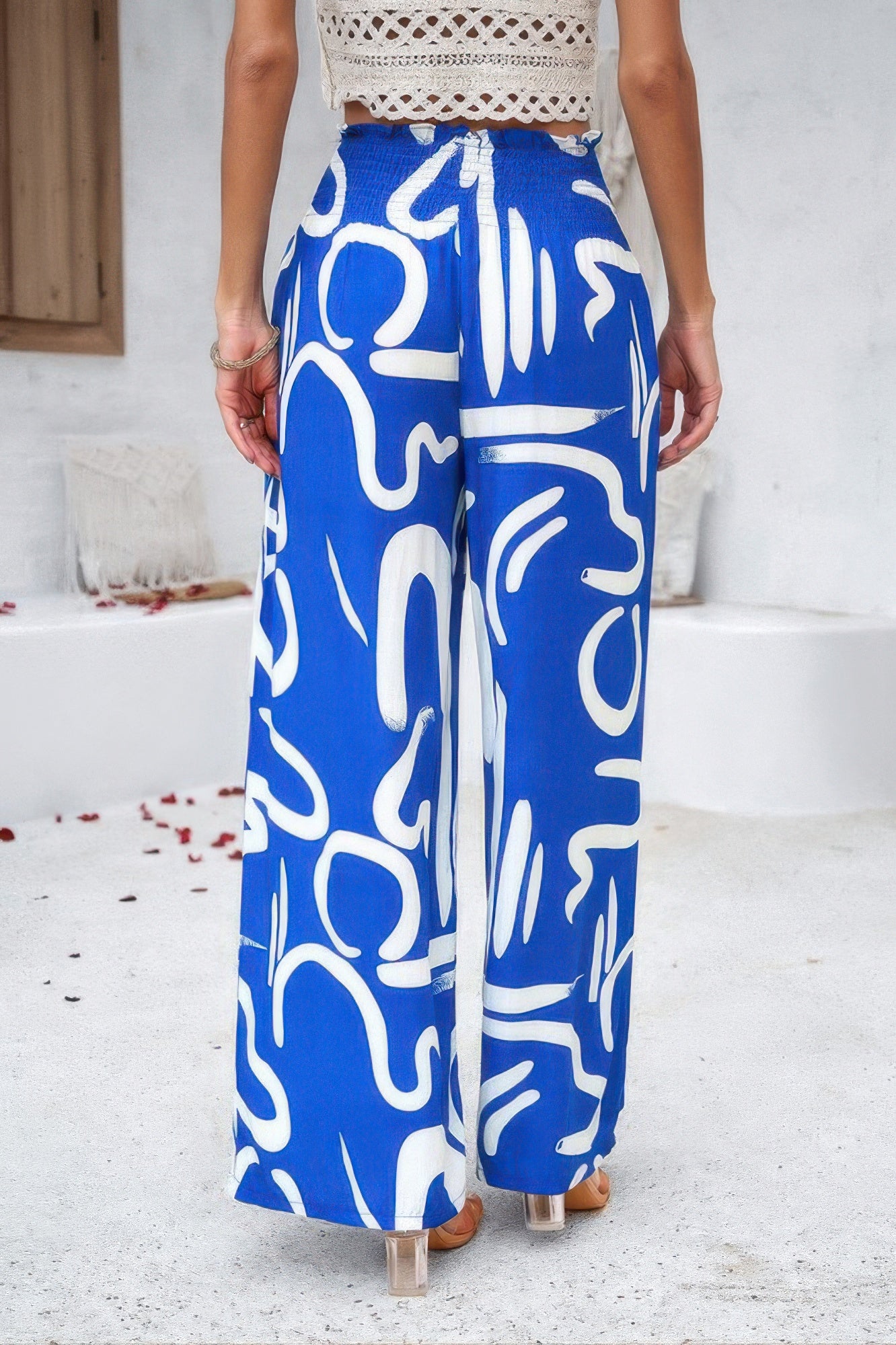 VacationGrabs women's allover print vacation pants in blue with white abstract patterns and wide-leg design