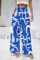 VacationGrabs women's allover print vacation pants in blue with white abstract design and wide leg style